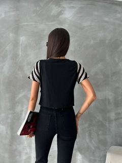 A wholesale clothing model wears top11125-raw-black-short-sleeve-zebra-pattern-crochet-blouse, Turkish wholesale Blouse of Topshow