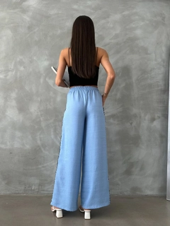 A wholesale clothing model wears top11215-blue-d-2625-sutade-detailed-trousers, Turkish wholesale Pants of Topshow
