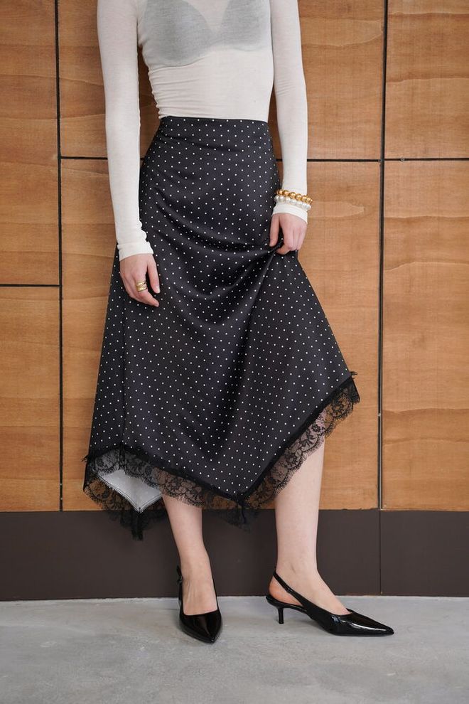 Topshow Black Elegant High Waist Polka Dot Asymmetrical Midi Skirt Wholesale Clothing Spring