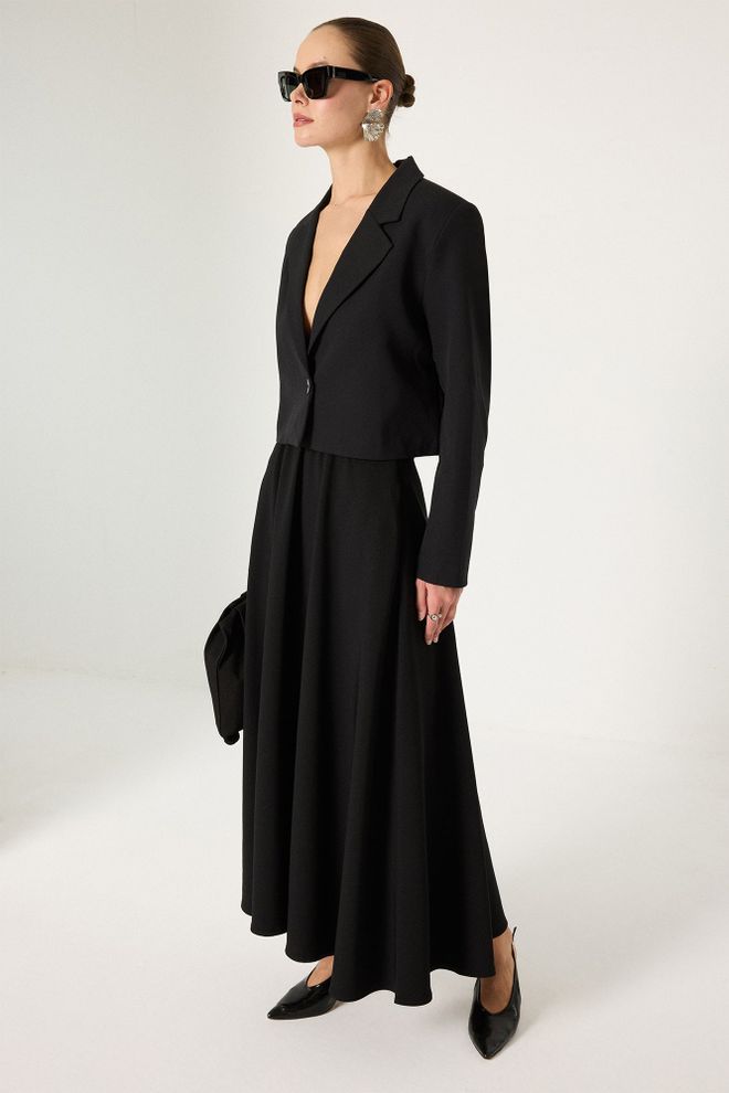 Touche Prive جيبة أسود أنيقة متوهجة ماكسي بأزرار ملابس بالجملة كلاسيكي