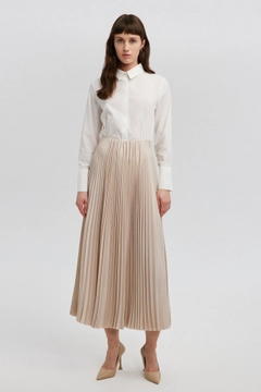 A wholesale clothing model wears tou12859-pleated-skirt-beige, Turkish wholesale Skirt of Touche Prive