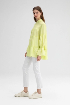 A model wears TOU10411 - Frilly Tunic With Laced Neck - Light Yellow, wholesale Tunic of Touche Prive to display at Lonca