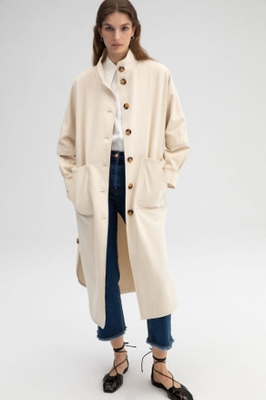 A model wears TOU10425 - Gabardine Trenchcoat With Neckband - Beige, wholesale Trenchcoat of Touche Prive to display at Lonca