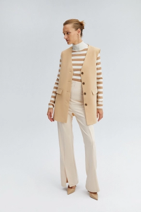 A model wears TOU10328 - Crepe Blazer Vest - Beige, wholesale Vest of Touche Prive to display at Lonca