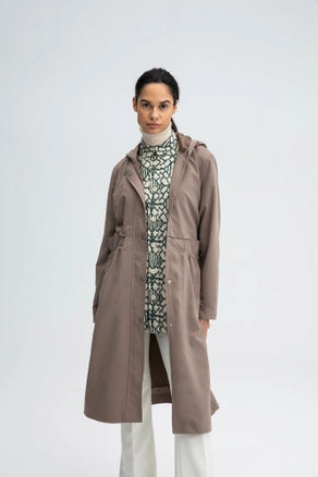 A model wears TOU10335 - Hooded Trenchcoat With Gripper - Mink, wholesale Trenchcoat of Touche Prive to display at Lonca
