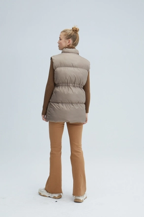 A model wears TOU10380 - Puffer Vest - Beige, wholesale Vest of Touche Prive to display at Lonca