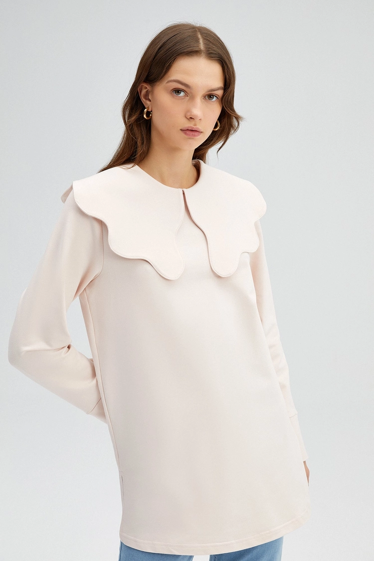 A model wears TOU11000 - Wide Collar Knit Tunic - Baby Pink, wholesale Tunic of Touche Prive to display at Lonca
