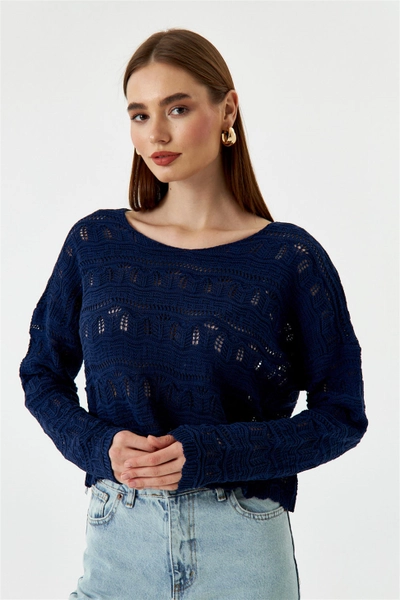 A model wears TBU10609 - Openwork Knitwear Women's Sweater - Navy Blue, wholesale Sweater of Tuba Butik to display at Lonca