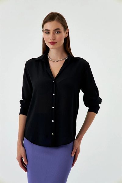 A model wears TBU10992 - Women's V Neck Satin Shirt - Black, wholesale Shirt of Tuba Butik to display at Lonca