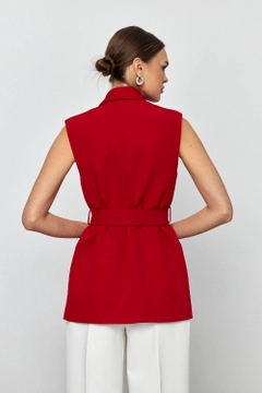 A wholesale clothing model wears tbu12177-belted-tuxedo-collar-women's-vest-red, Turkish wholesale Vest of Tuba Butik