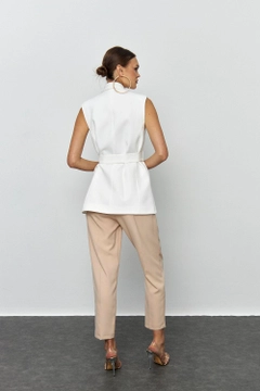 A wholesale clothing model wears tbu12173-belted-tuxedo-collar-women's-vest-white, Turkish wholesale Vest of Tuba Butik