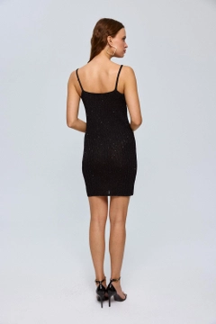 A wholesale clothing model wears tbu12636-strap-knitwear-mini-dress-black, Turkish wholesale Dress of Tuba Butik