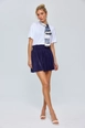 A wholesale clothing model wears tbu12706-pleated-mini-skirt-navy-blue, Turkish wholesale  of 