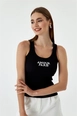 Ein Bekleidungsmodell aus dem Großhandel trägt tbu10883-women's-ribbed-basic-embroidered-athlete-black, türkischer Großhandel  von 