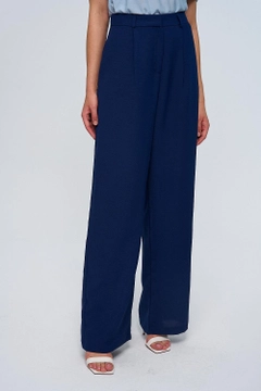 A wholesale clothing model wears tbu12776-darted-palazzo-women's-trousers-navy-blue, Turkish wholesale Pants of Tuba Butik