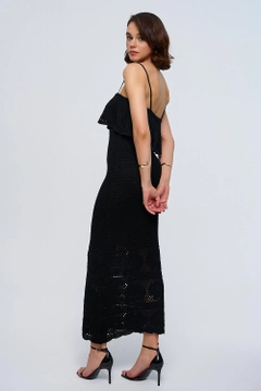 A wholesale clothing model wears tbu12780-strappy-openwork-knitwear-long-dress-black, Turkish wholesale Dress of Tuba Butik