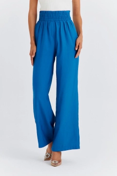 A wholesale clothing model wears TBU11763 - Women's Wide Leg Flowy Trousers - Blue, Turkish wholesale Pants of Tuba Butik