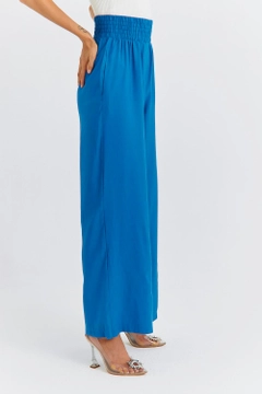 A wholesale clothing model wears TBU11763 - Women's Wide Leg Flowy Trousers - Blue, Turkish wholesale Pants of Tuba Butik