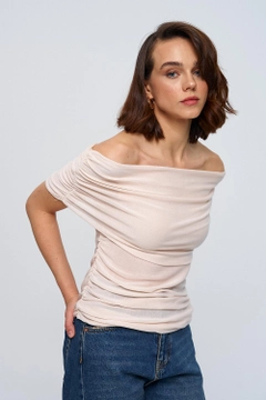 A wholesale clothing model wears tbu12772-madonna-collar-gathered-knitwear-women's-blouse-cream, Turkish wholesale Blouse of Tuba Butik