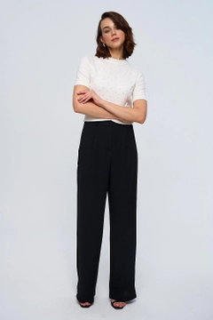 A wholesale clothing model wears tbu12800-women's-palazzo-trousers-with-darts-black, Turkish wholesale Pants of Tuba Butik