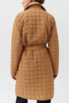 A wholesale clothing model wears TBU10317 - Modest Quilted Long Belt Slim Women's Jacket - Light Brown, Turkish wholesale Jacket of Tuba Butik