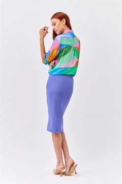 Bir model, Tuba Butik toptan giyim markasının 35947 - Skirt - Purple toptan Etek ürününü sergiliyor.