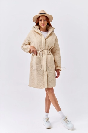 A model wears 36238 - Coat - Beige, wholesale undefined of Tuba Butik to display at Lonca