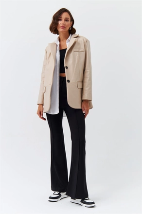 A model wears 36336 - Jacket - Stone, wholesale undefined of Tuba Butik to display at Lonca