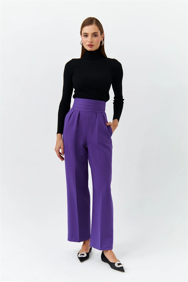 A model wears 47451 - Trousers - Purple, wholesale Pants of Tuba Butik to display at Lonca