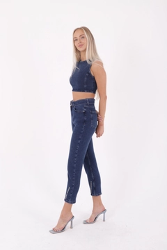 A wholesale clothing model wears xlo10156-dropped-and-extra-detailed-mom-fit-jean-dark-blue, Turkish wholesale Jeans of XLove