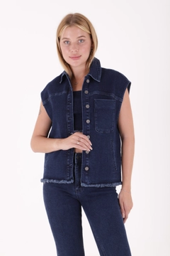 A wholesale clothing model wears xlo10220-buttoned-front-tasseled-denim-vest-dark-blue, Turkish wholesale Vest of XLove