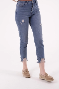 A wholesale clothing model wears xlo10225-high-waist-mom-fit-ankle-length-jeans-with-laser-legs-blue, Turkish wholesale Jeans of XLove