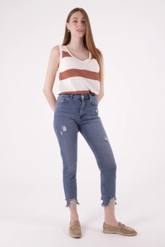 A wholesale clothing model wears xlo10225-high-waist-mom-fit-ankle-length-jeans-with-laser-legs-blue, Turkish wholesale Jeans of XLove